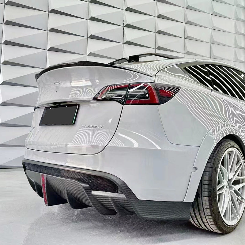 Tesla Model Y SD-style rear diffuser installed rear three quarter view