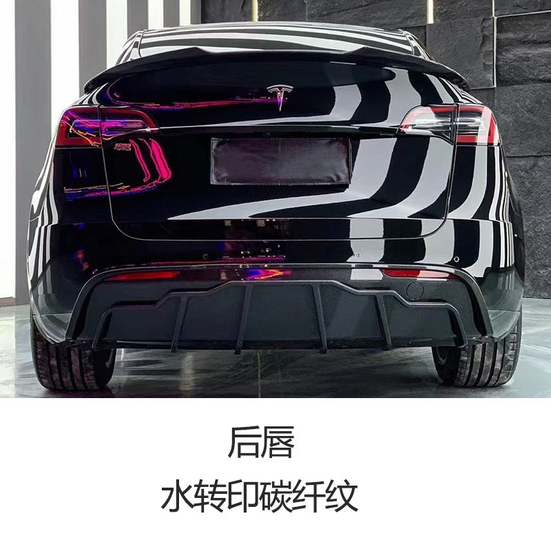 Tesla Model Y FAST-style hydro carbon rear diffuser installed