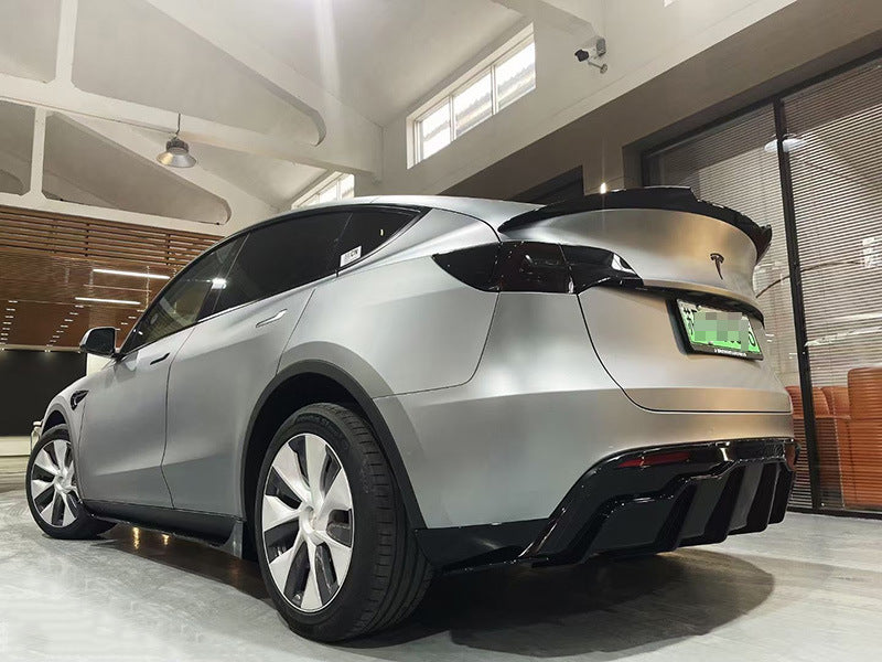 Tesla Model Y FAST-style gloss black rear spoiler installed