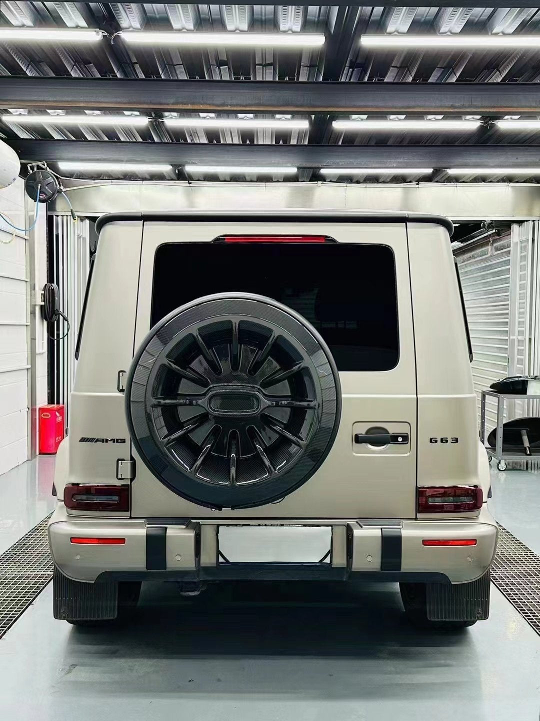 Mercedes G-Class W464 dry carbon spare tire cover installed rear view
