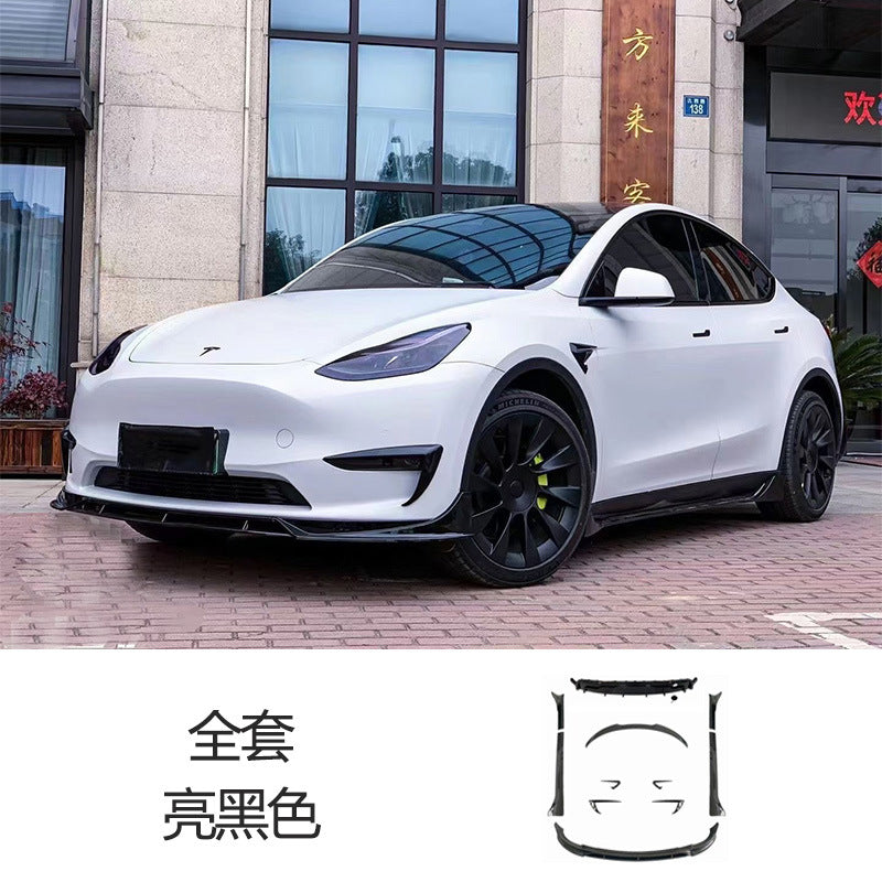 Tesla Model Y FAST-style gloss black full aero kit installed