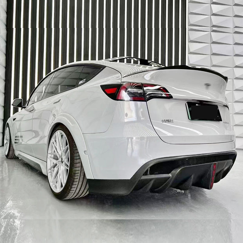 Tesla Model Y SD-style rear diffuser installed on white vehicle